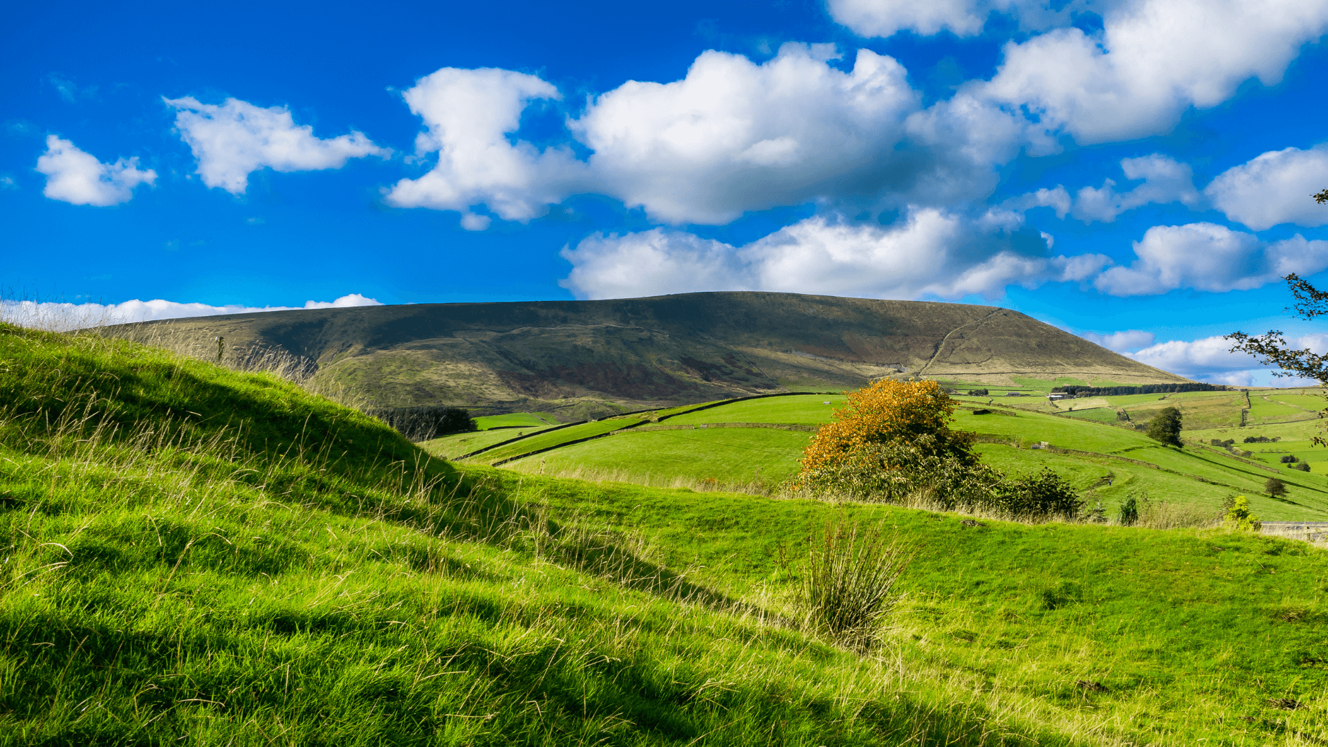 Pendle Hill with bright blue summer skies